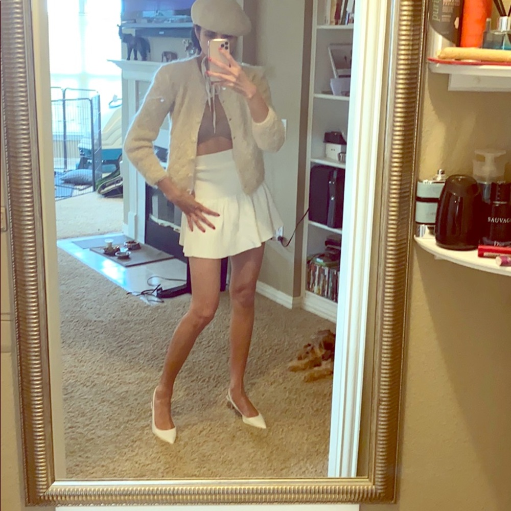 Cardigan $80  Skirt $130 Hat $60 Shoes $120